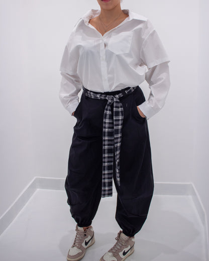 Pantaloni balloon con cintura a quadri.